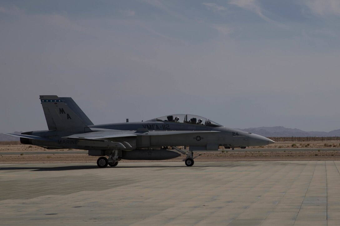 Col. Steven J. White, commanding officer of Marine Air Ground Task Force 23, and Lt. Col. Jeremy Yauck, F/A-18 Hornet pilot with Marine Fighter Attack Squadron 112, Marine Aircraft Group 41, 4th Marine Aircraft Wing, land at Camp Wilson flight line, during Integrated Training Exercise 4-18 in Marine Corps Air Ground Combat Center Twentynine Palms, California, June 10, 2018. ITX 4-18 provides MAGTF elements an opportunity to undergo a service-level assessment of core competencies that are essential to expeditionary, forward-deployed operations. (U.S. Marine Corps photo by Lance Cpl. Samantha Schwoch/released)