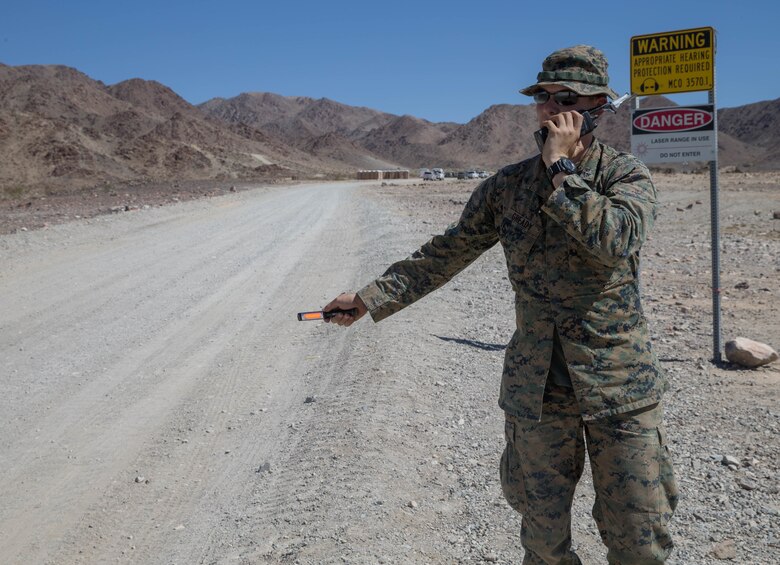 Lance Cpl. Robert Gready, an ammunition technician with Weapons Company, 1st Battalion, 23rd Marine Regiment, 4th Marine Division, conducts a radio check on range 410A, a platoon reinforced attack range, during Integrated Training Exercise 4-18 at Marine Corps Air Ground Combat Center Twentynine Palms, California, June 11, 2018. ITX 4-18 provides MAGTF elements an opportunity to undergo a service-level assessment of core competencies that are essential to expeditionary, forward-deployed operations. (U.S. Marine Corps photo by Lance Cpl. Samantha Schwoch/released)