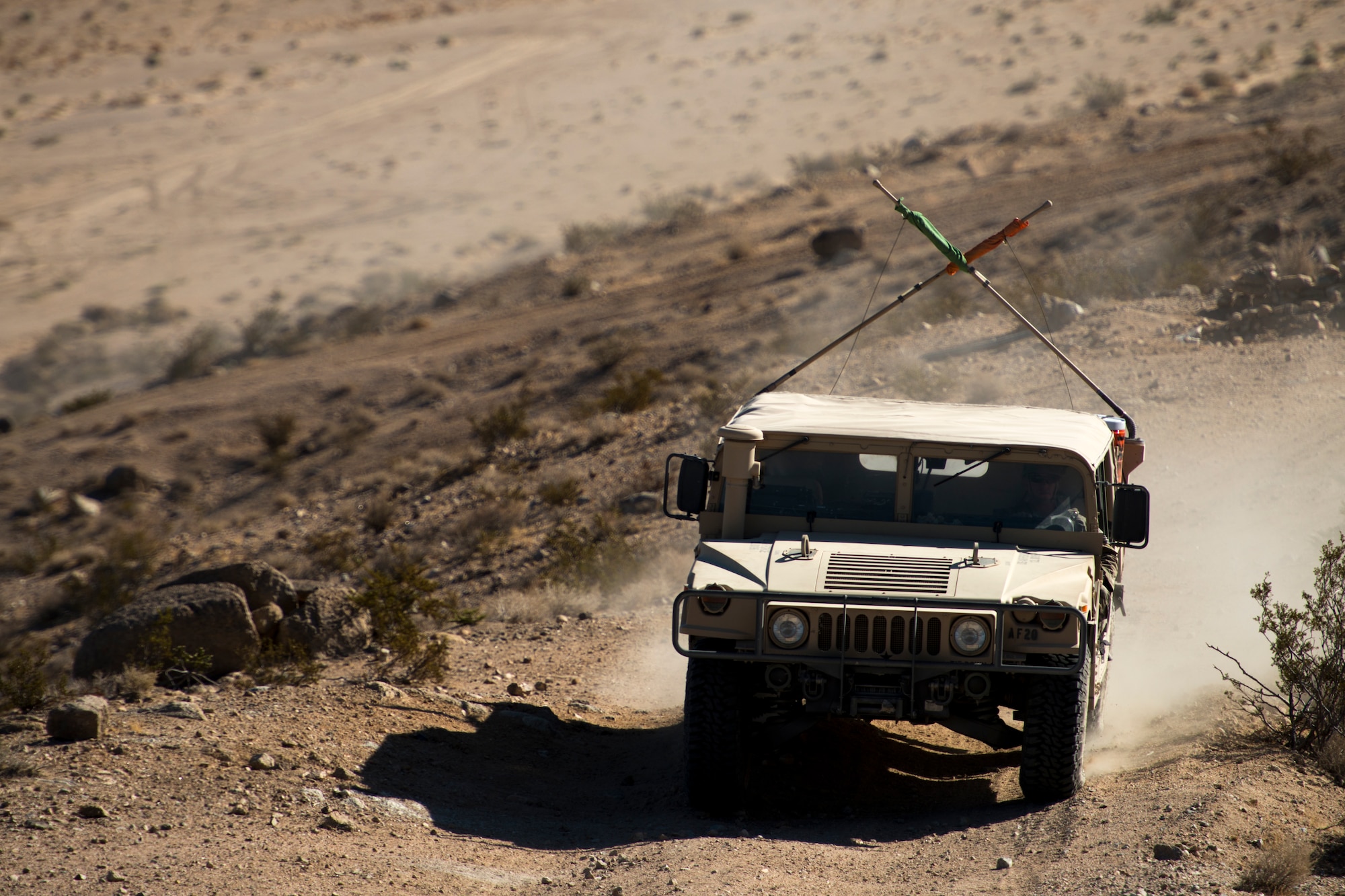 Staff Sgt. Dustin Selljes, 12th Combat Training Squadron joint terminal attack controller, drives a Humvee up a mountain during Green Flag West, June 12, 2018, at the National Training Center, Ft. Irwin, California. The NTC replicates the tough, realistic operational environment that America’s war fighters face in combat. (U.S. Air Force photo by Airman 1st Class JaNae Capuno)
