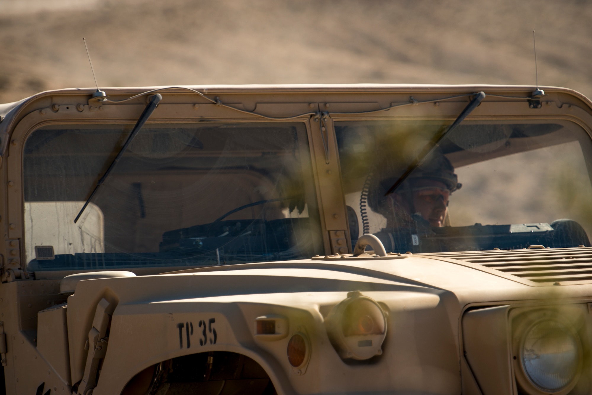 Staff Sgt. Michael Pinchiera, 12th Combat Training Squadron joint terminal attack controller, drives a Humvee during Green Flag West, June 12, 2018, at the National Training Center, Ft. Irwin, California. The NTC replicates the tough, realistic operational environment that America’s war fighters face in combat. (U.S. Air Force photo by Airman 1st Class JaNae Capuno)
