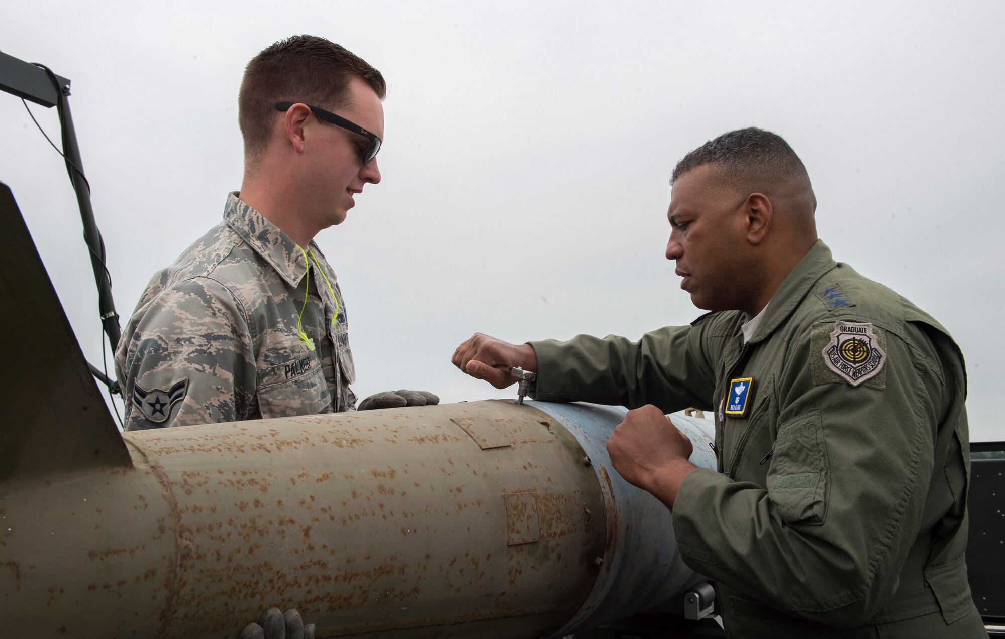 U.S. Air Force Lt. Gen. Richard Clark, 3rd Air Force Commander, tightens a stabilizing fin to a training bomb at RAF Fairford, June 7, 2018. Clark demonstrated that even turning a wrench is a vital step in getting bombs on targets. (U.S. Air Force photo by Senior Airman Chase Sousa)
