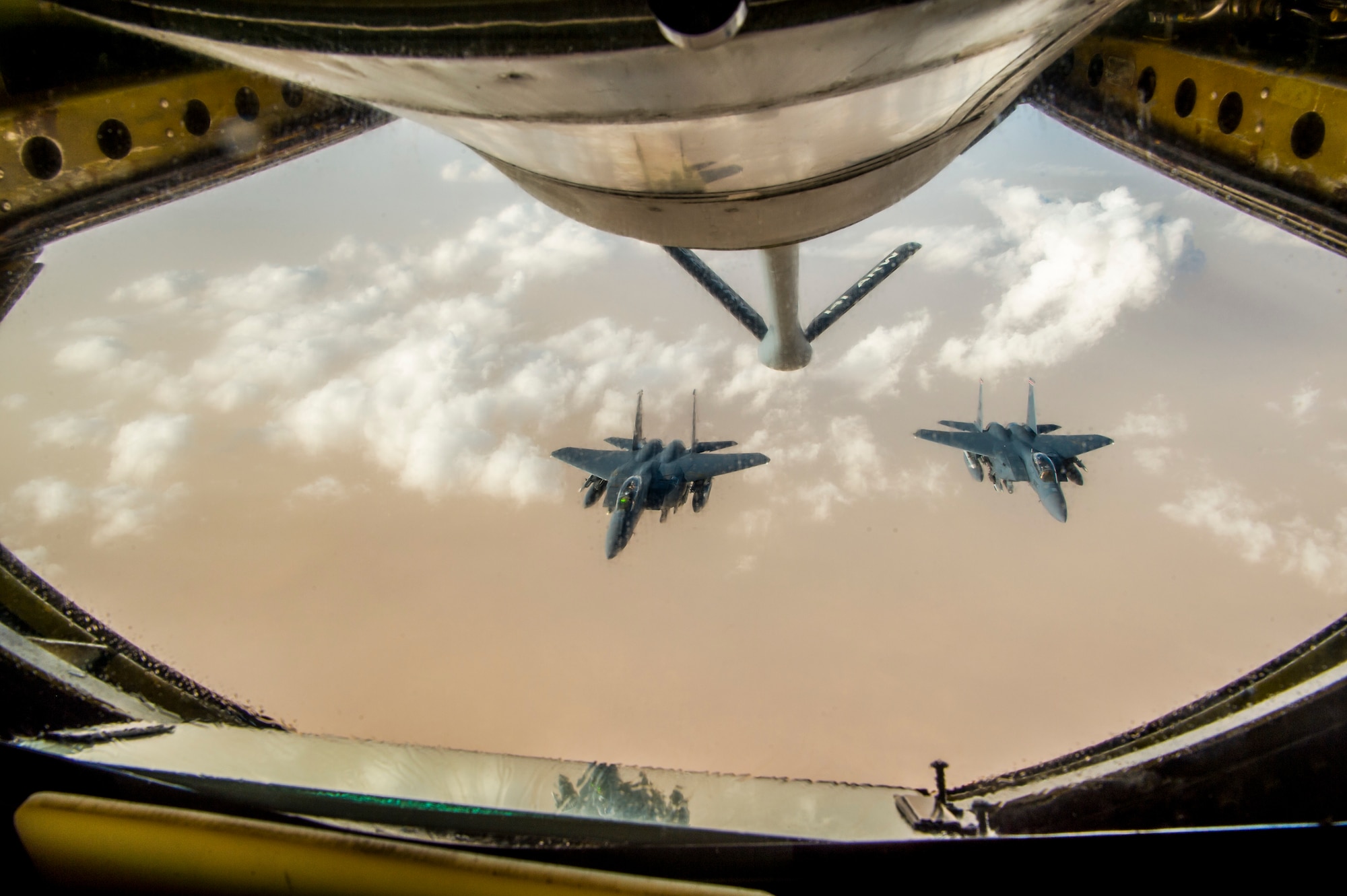 Two U.S. Air Force  F-15 Eagles fly in formation after receiving fuel from a KC-135 Stratotanker assigned to the 340th Expeditionary Air Refueling Squadron during a aerial refueling mission in support of Operation Inherent Resolve over Iraq, May 5, 2018. The 340th EARS is assigned to the 379th Expeditionary Operations Group and supports various operations in countries such as Iraq, Syria and Afghanistan