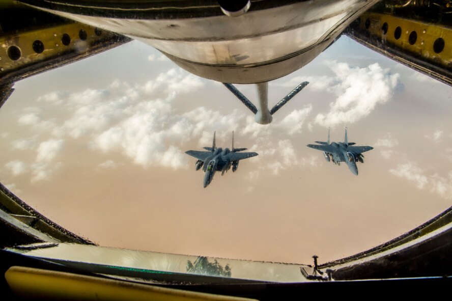 Two U.S. Air Force  F-15 Eagles fly in formation after receiving fuel from a KC-135 Stratotanker assigned to the 340th Expeditionary Air Refueling Squadron during a aerial refueling mission in support of Operation Inherent Resolve over Iraq, May 5, 2018. The 340th EARS is assigned to the 379th Expeditionary Operations Group and supports various operations in countries such as Iraq, Syria and Afghanistan