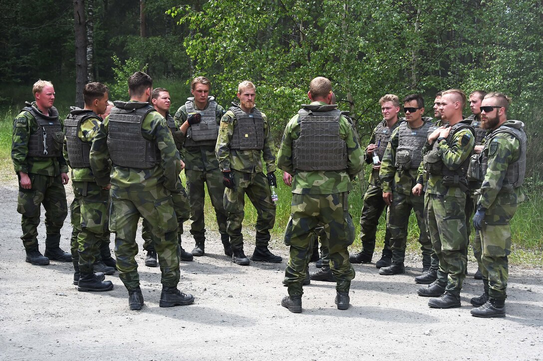 Swedish soldiers receive a mission and safety brief.