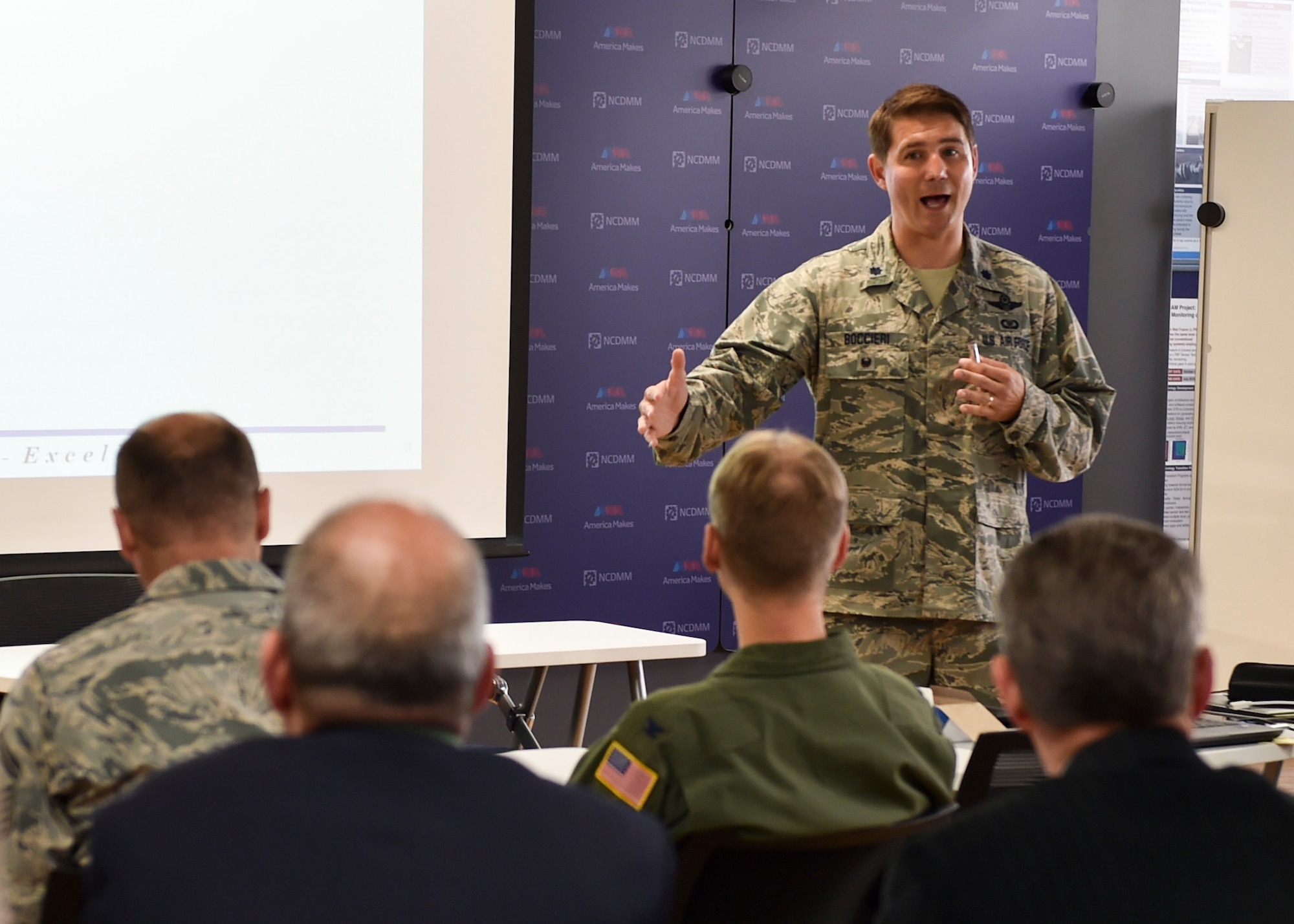 Lt. Col. John Boccieri, director of the 910th Airlift Wing Commander’s Action Group, addresses the benefits of the Air Force Community Partnership Program during a meeting at America Makes in Youngstown, June 14, 2018.
