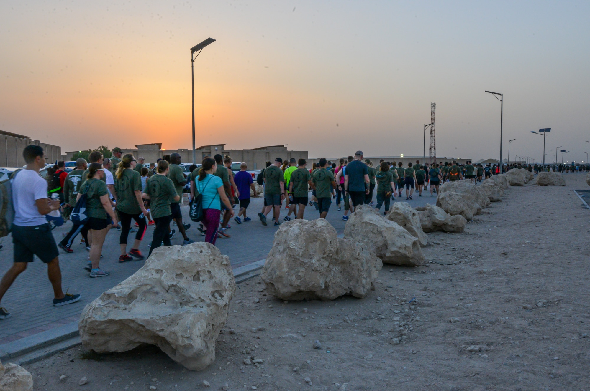 Service members participate in a mental health awareness walk at Al Udeid Air Base, Qatar, May 31, 2018. The walk was hosted by the 379th Expeditionary Medical Group Mental Health Clinic to raise awareness to the many resources available for those experiencing negative mental health symptoms. (U.S. Air Force photo by 1st Lt. Katie Spencer)