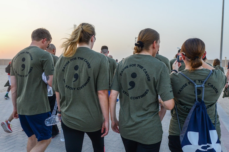 Service members participate in a mental health awareness walk at Al Udeid Air Base, Qatar, May 31, 2018. The walk was hosted by the 379th Expeditionary Medical Group Mental Health Clinic to raise awareness to the many resources available for those experiencing negative mental health symptoms. (U.S. Air Force photo by 1st Lt. Katie Spencer)