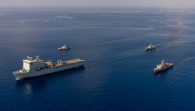 Ships sail in formation in the Atlantic Ocean.