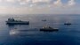 Ships sail in formation in the Atlantic Ocean.