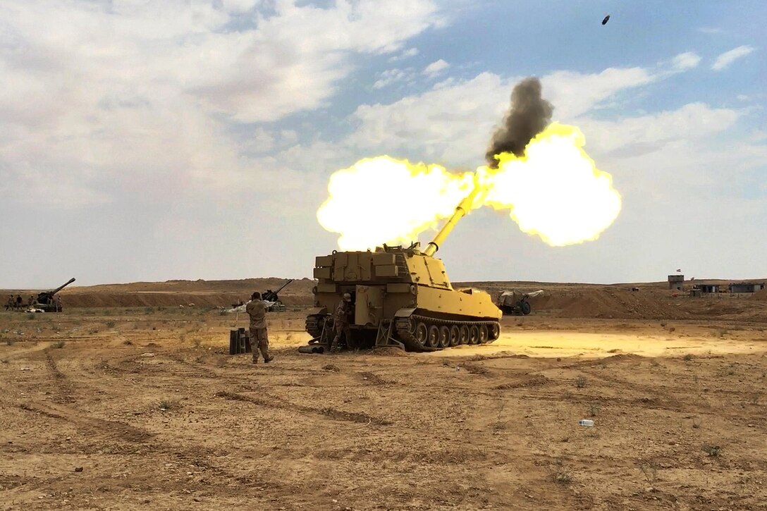Iraqi Security Forces fire a M109A6 Paladin self-propelled howitzer.