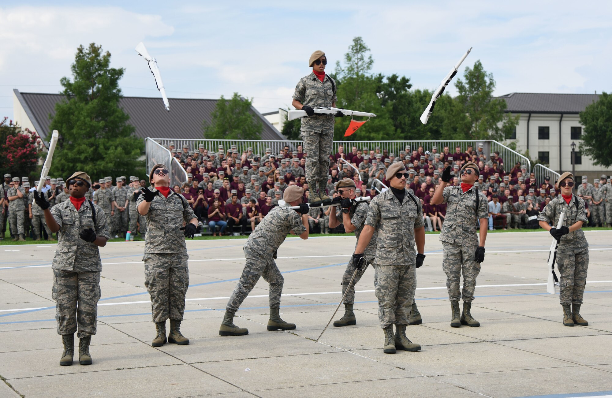 Members of the 335th Training Squadron freestyle drill team perform during the 81st Training Group drill down on the Levitow Training Support Facility drill pad at Keesler Air Force Base, Mississippi, June 15, 2018. Airmen from the 81st TRG competed in a quarterly open ranks inspection, regulation drill routine and freestyle drill routine. (U.S. Air Force photo by Kemberly Groue)