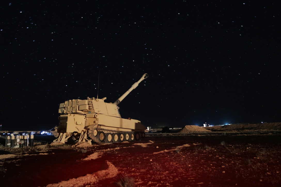 Iraqi Security Forces prepare to fire a M109A6 Paladin self-propelled howitzer.