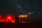U.S. soldiers and Iraqi Security Force fire a howitzer.