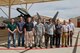 Arnold Engineering Development Complex Junior Force Council members pause for a photo in front of an F-22 Raptor during a tour of the 411th Combined Test Force at Edwards Air Force Base. Pictured from left are Nicholas Perry, Christopher Hartley, Brandon Hoffman, Dan Ogg, Capt. Michael Davault, Stephen Maccarino, Christopher Northrup, Michael Glennon, Becky Morris, Tyler McCamey and Elijah Minter. (U.S. Air Force photo/Christopher Higgins)