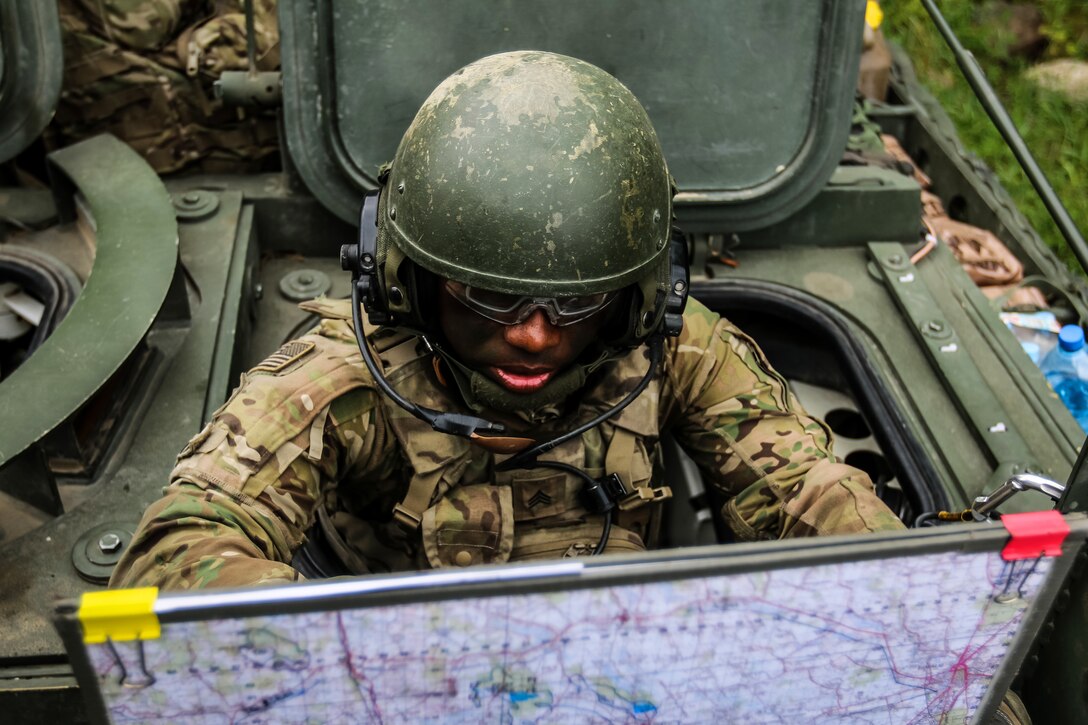 Sgt. Dellon Tobin organizes a troop movement during exercise Puma 2 Operation.