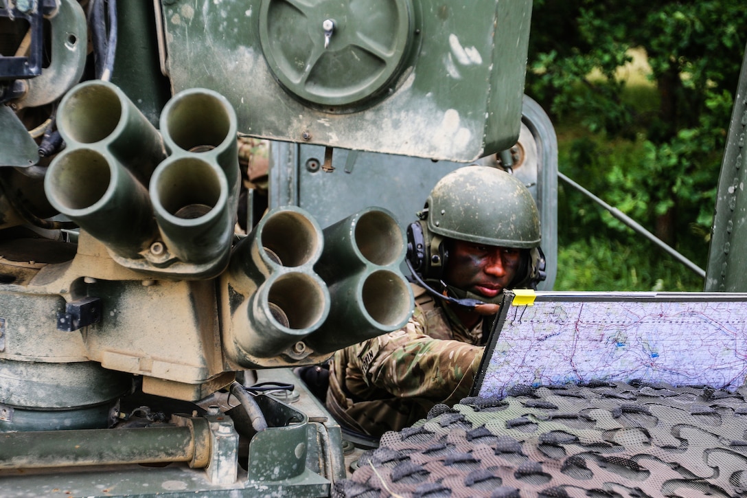A soldier organizes a troop movement during exercise Puma 2 Operation.
