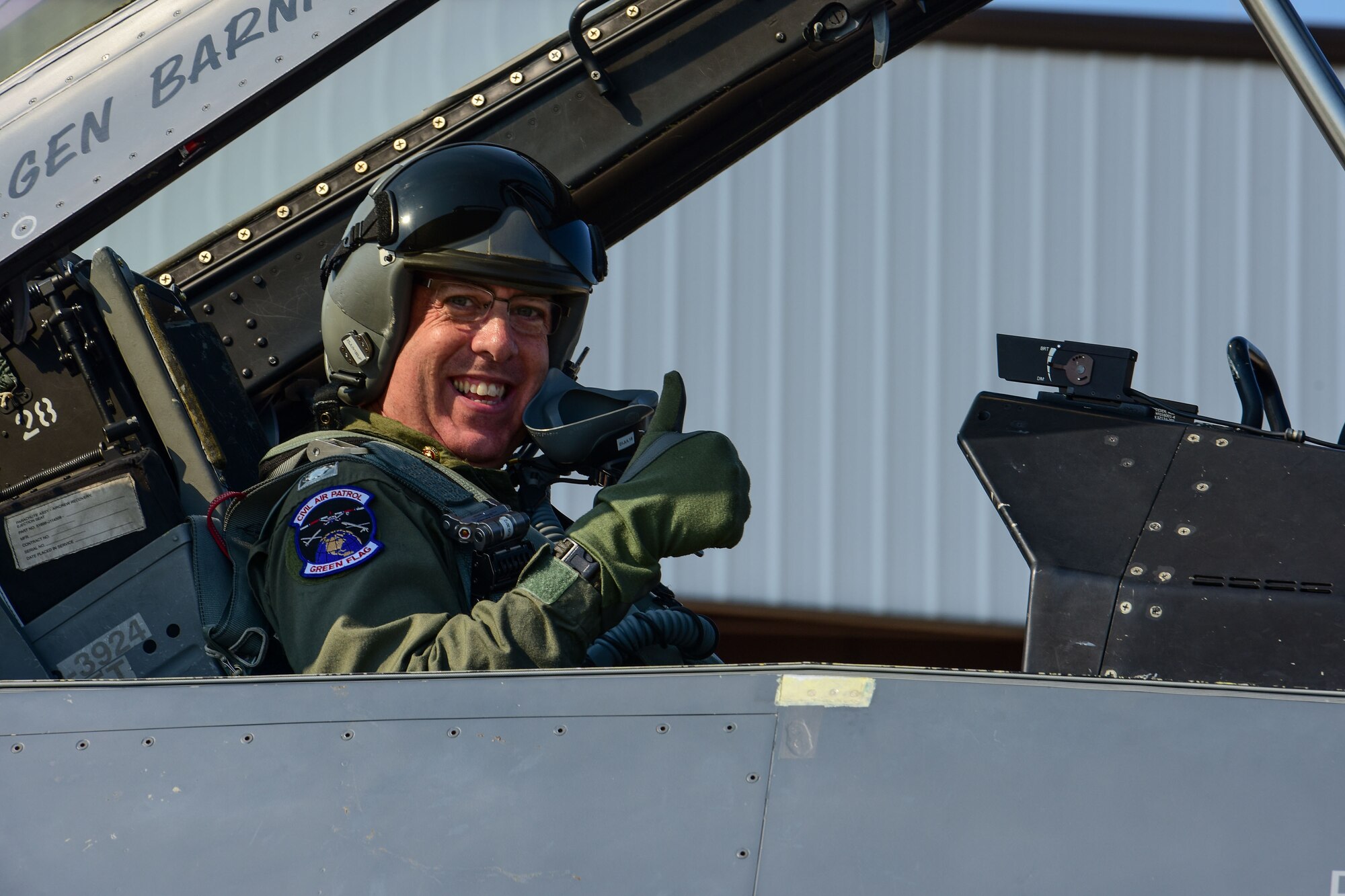 U.S. Civil Air Patrol Lt. Col. Brett Grooms, the legislative commander of the Civil Air Patrol's South Carolina Wing, gives a thumbs up prior to an aerospace control alert familiarization flight in an F-16 Fighting Falcon fighter jet from the South Carolina Air National Guard June 11. The 169th FW, in close coordination with the Continental U.S. North American Aerospace Defense Command Region, the Eastern Air Defense Sector and the Federal Aviation Administration had recently hosted a Southeast Aerospace Control Alert June 5-7, but weather delays precluded Grooms from flying during the actual SACA event. The conference was a total team training initiative to improve homeland defense capabilities by developing techniques with joint forces during small-scale exercises. This conference consisted of SCANG 169FW F-16 fighter jets, U.S. Coast Guard Rotary Wing Air Intercept Squadron MH-65D Dolphin helicopters from USCG Air Station Atlantic City and South Carolina Wing Civil Air Patrol aircraft and crews to hone their skills with tactical-level air-intercept procedures. (U.S. Air National Guard photo by Senior Airman Megan Floyd)