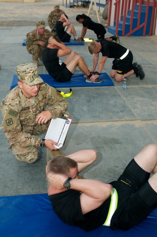 Competitors perform sit-ups during the 2016 U.S. Army Central Command Best Warrior Noncommissioned Officer and Soldier of the Year Competition, 19-21 June, at Camp Buehring, Kuwait. Fourteen Soldiers faced off in temperatures nearing 120 degrees competing in multiple events designed to test the Soldiers mental and physical capabilities while focusing on warrior tasks. The events included: a six-mile ruck march, Army physical fitness test, rifle qualification, two physical challenge events, a board appearance, written examination, combatives tournament, and a warrior tasks assessment.