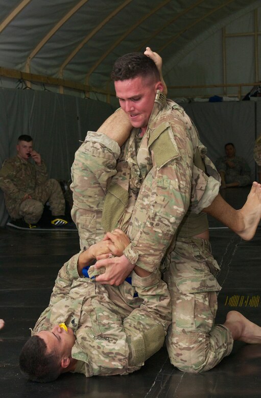 Competitors fight for position in a combatives tournament during the 2016 U.S. Army Central Command Best Warrior Noncommissioned Officer and Soldier of the Year Competition, 19-21 June, at Camp Buehring, Kuwait. Fourteen Soldiers faced off in temperatures nearing 120 degrees competing in multiple events designed to test the Soldiers mental and physical capabilities while focusing on warrior tasks. The events included: a six-mile ruck march, Army physical fitness test, rifle qualification, two physical challenge events, a board appearance, written examination, combatives tournament, and a warrior tasks assessment.