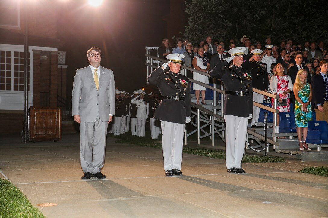 The official party for a Friday Evening Parade renders honors during the ceremony at Marine Barracks Washington D.C., June 15, 2018. The guest of honor for the parade was Under Secretary of Defense for Personnel and Readiness, the Honorable Robert Wilkie, and was hosted by Military Under Secretary of Defense for Personnel and Readiness, Lt. Gen. H. Stacy Clardy. (Official U.S. Marine Corps photo by Cpl. Damon Mclean/Released)