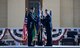 Brig. Gen. Darren James, 18th Air Force vice commander, passes the 92nd Air Refueling Wing guidon to Col. Derek Salmi, 92nd ARW commander, during an assumption of command ceremony June 15, 2018, at Fairchild Air Force Base, Wash. During the ceremony, a guidon is passed to symbolize the passing of responsibility of the wing to a commander. (U.S. Air Force photo/ Senior Airman Sean Campbell)