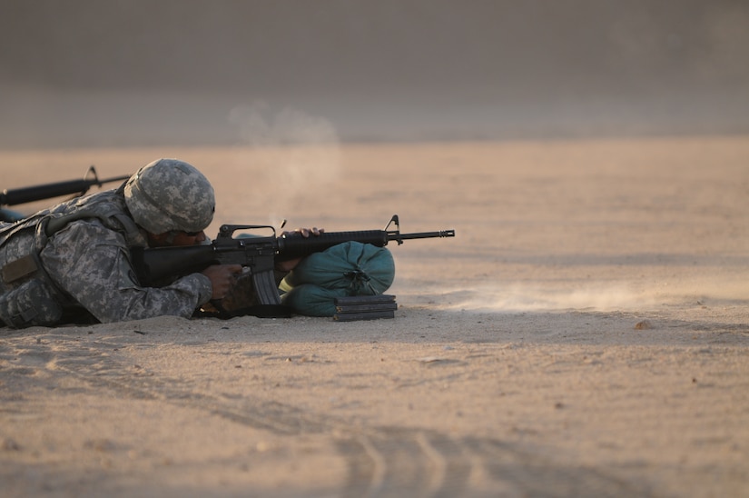 Sgt. Davyon Burroughs of 4th Battalion, 5th Air & Missiles Defense Regiment shoots a M16 rifle during the zero and targeting event of the "Best Warrior" NCO/Soldier of the Year competition at Camp Buerhing, Kuwait. The yearly competition tests the competing soldiers' aptitude, physical fitness and accessed them in warrior tasks and battle drills relevant to today's operating environment.