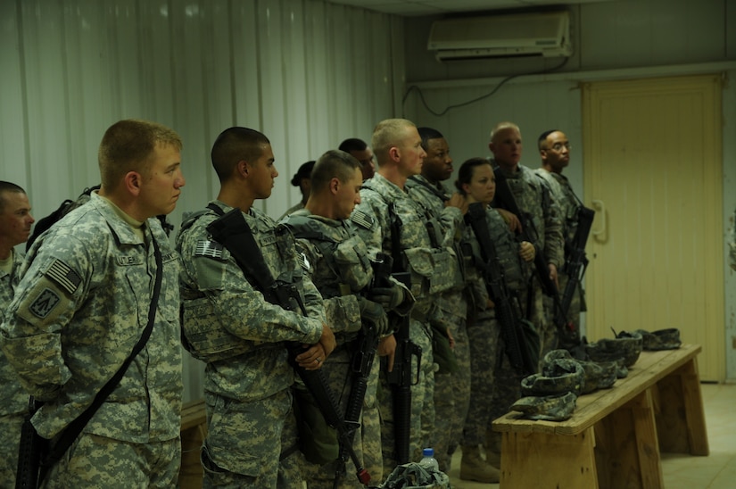 Third Army soldiers receive a safety brief prior to the warrior drills event in the "Best Warrior" NCO/Soldier of the Year competition at Camp Buerhing, Kuwait. The yearly competition tests the competing soldiers' aptitude, physical fitness and assessed them in warrior tasks and battle drills relevant to today's operating environment.