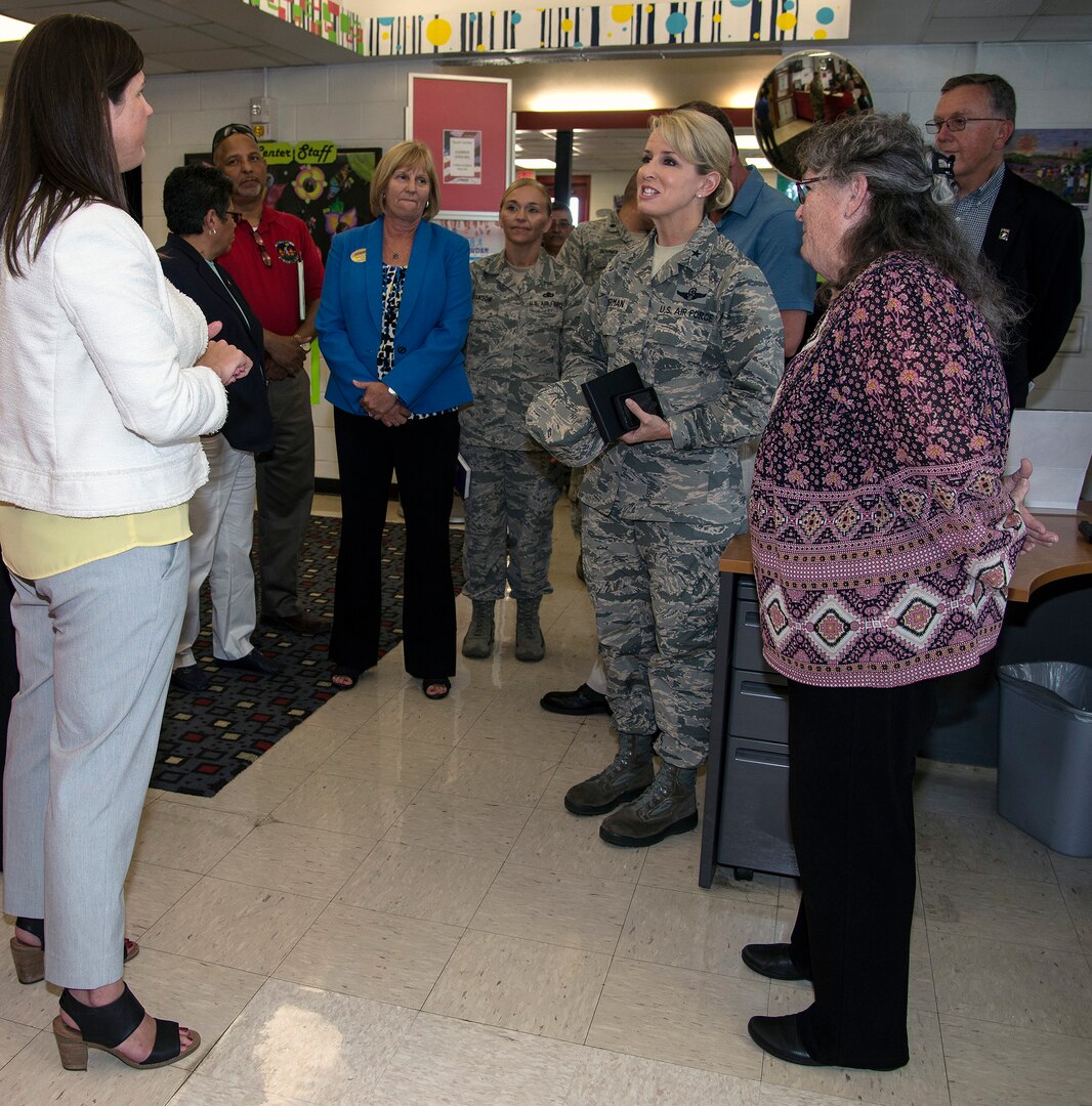 Brig. Gen. Laura L. Lenderman (center), 502nd Air Base Wing and Joint Base San Antonio commander, talks with Amanda Wood (left), Chief, Child and Youth Services Flight, and Jeanne Warren (right), JBSA-Fort Sam Houston Youth Director, during a stop at the JBSA-Fort Sam Houston Youth Center June 15. The general visited the center as part of an immersion tour, which included stops at the Academic Support Center, Student Activity Center, the vehicle maintenance facility, Jimmy Brought Fitness Center, and Military & Family Readiness Center.