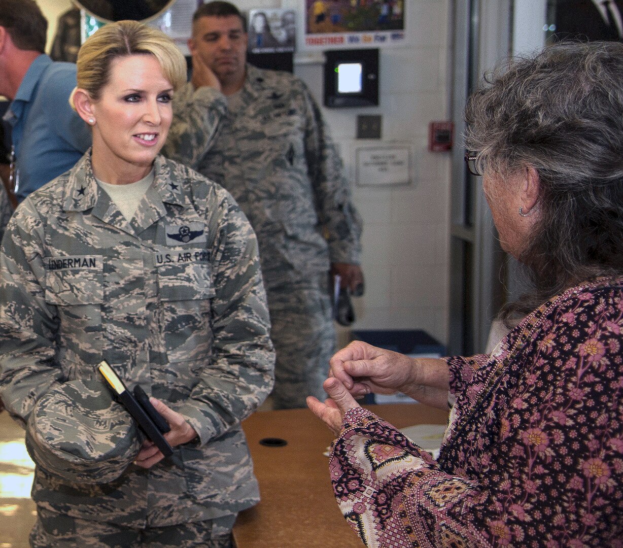 Brig. Gen. Laura L. Lenderman (left)), 502nd Air Base Wing and Joint Base San Antonio commander, talks with Jeanne Warren (right), JBSA-Fort Sam Houston Youth Director, during a stop at the JBSA-Fort Sam Houston Youth Center June 15. The general visited the center as part of an immersion tour, which included stops at the Academic Support Center, Student Activity Center, the vehicle maintenance facility, Jimmy Brought Fitness Center, and Military & Family Readiness Center.