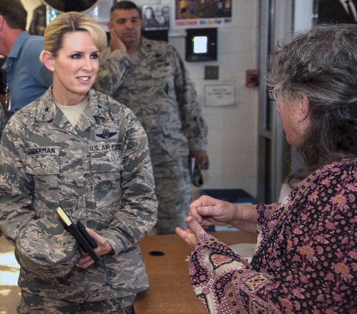 Brig. Gen. Laura L. Lenderman (left)), 502nd Air Base Wing and Joint Base San Antonio commander, talks with Jeanne Warren (right), JBSA-Fort Sam Houston Youth Director, during a stop at the JBSA-Fort Sam Houston Youth Center June 15. The general visited the center as part of an immersion tour, which included stops at the Academic Support Center, Student Activity Center, the vehicle maintenance facility, Jimmy Brought Fitness Center, and Military & Family Readiness Center.