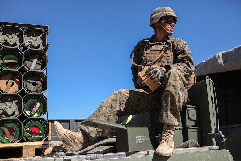 Lance Cpl. Alberto Sepulveda, a motor transportation operator with Mike Battery, 3rd Battalion, 14th Marine Regiment, 4th Marine Division, helps transport and unload ammunition for a direct fire shoot at Integrated Training Exercise 4-18 in Twentynine Palms, California, June 13, 2018. ITX 4-18 is a live-fire and maneuver combined arms exercise designed to train battalion and squadron-sized units in tactics, techniques, and procedures required to provide a sustainable and ready operational reserve for employment across the full spectrum of crisis and global engagement.