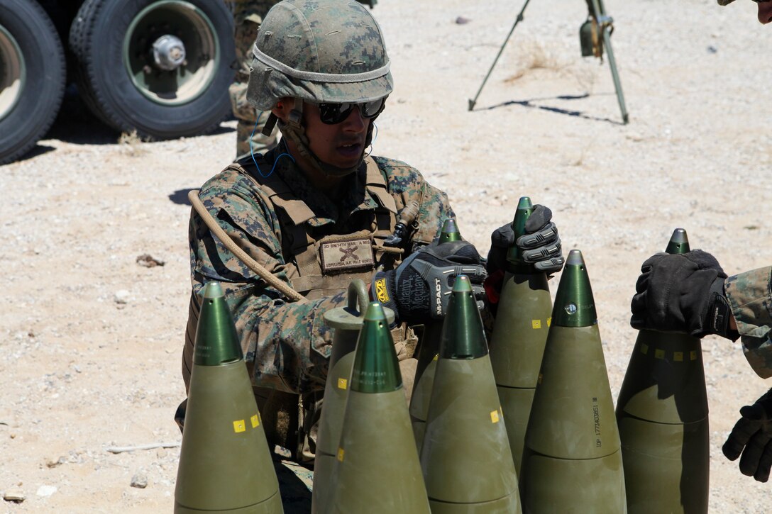 Lance Cpl. Alberto Sepulveda, a motor transportation operator with Mike Battery, 3rd Battalion, 14th Marine Regiment, 4th Marine Division, helps transport and unload ammunition for a direct fire shoot at Integrated Training Exercise 4-18 in Twentynine Palms, California, June 13, 2018. ITX 4-18 is a live-fire and maneuver combined arms exercise designed to train battalion and squadron-sized units in tactics, techniques, and procedures required to provide a sustainable and ready operational reserve for employment across the full spectrum of crisis and global engagement.