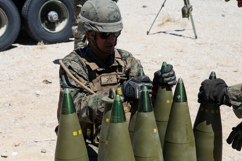 Lance Cpl. Alberto Sepulveda, a motor transportation operator with Mike Battery, 3rd Battalion, 14th Marine Regiment, 4th Marine Division, helps transport and unload ammunition for a direct fire shoot at Integrated Training Exercise 4-18 in Twentynine Palms, California, June 13, 2018. ITX 4-18 is a live-fire and maneuver combined arms exercise designed to train battalion and squadron-sized units in tactics, techniques, and procedures required to provide a sustainable and ready operational reserve for employment across the full spectrum of crisis and global engagement.