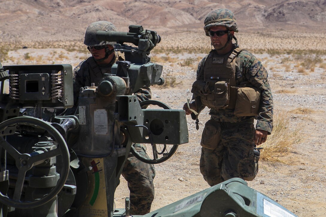 Cpl. Jonathan W. Corwyn, a Field Artillery Cannoneer, with Mike Battery, 3rd Battalion, 14th Marine Regiment, 4th Marine Division, commands the Howitzer during a direct fire shoot at Integrated Training Exercise 4-18 in Twentynine Palms, California, June 13, 2018. ITX 4-18 is a live-fire and maneuver combined arms exercise designed to train battalion and squadron-sized units in tactics, techniques, and procedures required to provide a sustainable and ready operational reserve for employment across the full spectrum of crisis and global engagement.