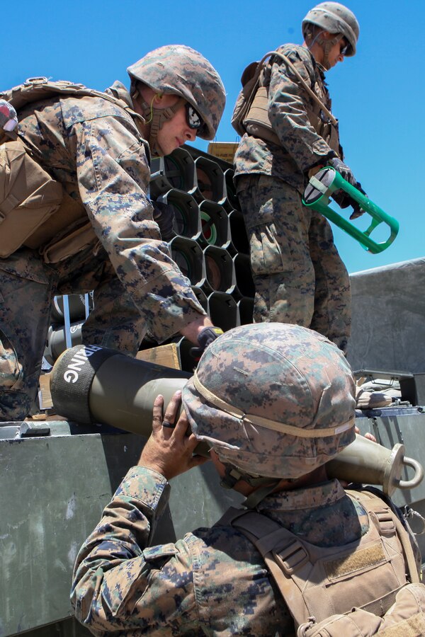 Corporal Jonathan W. Corwin, a Field Artillery Cannoneer, with Mike Battery, 3rd Battalion, 14th Marine Regiment, 4th Marine Division, helps unload ammunition during a direct fire shoot at Integrated Training Exercise 4-18 in Twentynine Palms, California, June 13, 2018. ITX 4-18 is a live-fire and maneuver combined arms exercise designed to train battalion and squadron-sized units in tactics, techniques, and procedures required to provide a sustainable and ready operational reserve for employment across the full spectrum of crisis and global engagement.