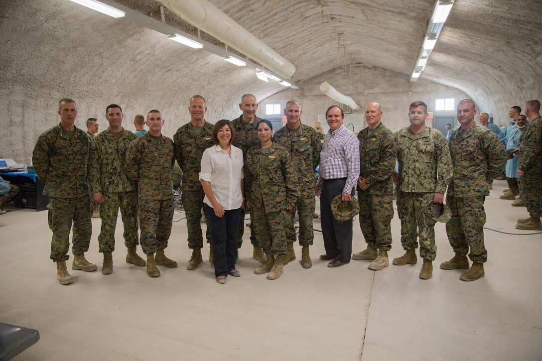 Distinguished visitors pose for a photograph with key leaders in 4th Medical battalion, 4th Marine Logistics Group, during Integrated Training Exercise 4-18 at Marine Corps Air Ground Combat Center Twentynine Palms, Calif., June 13, 2018.