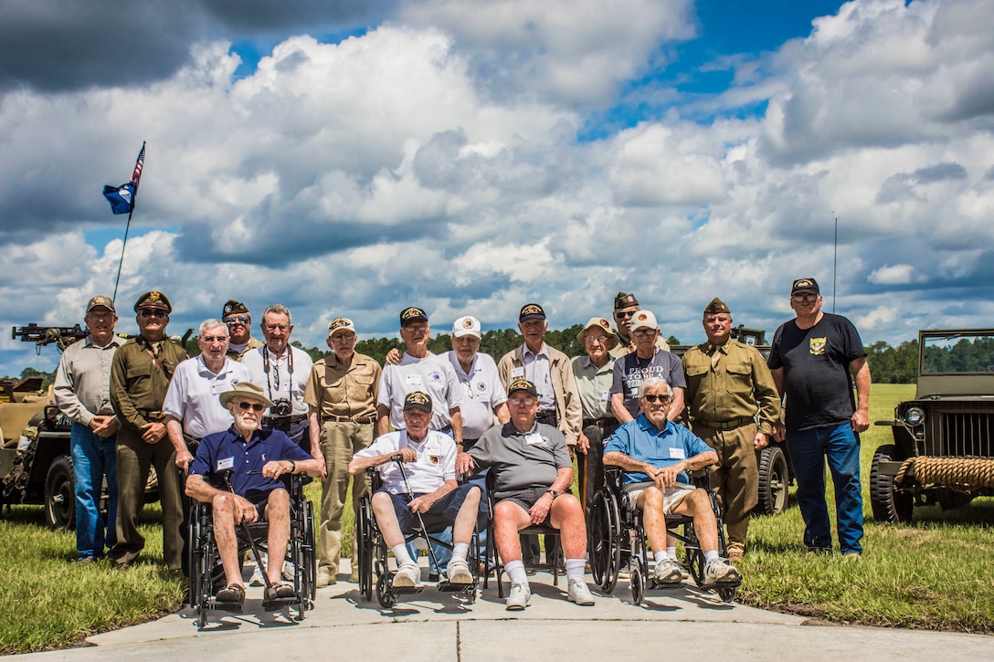 Veterans of the Army 66th Infantry Division pose for a group photo during the division's final reunion and site dedication at Camp Blanding Joint Training Center's museum in Starke, Fla.