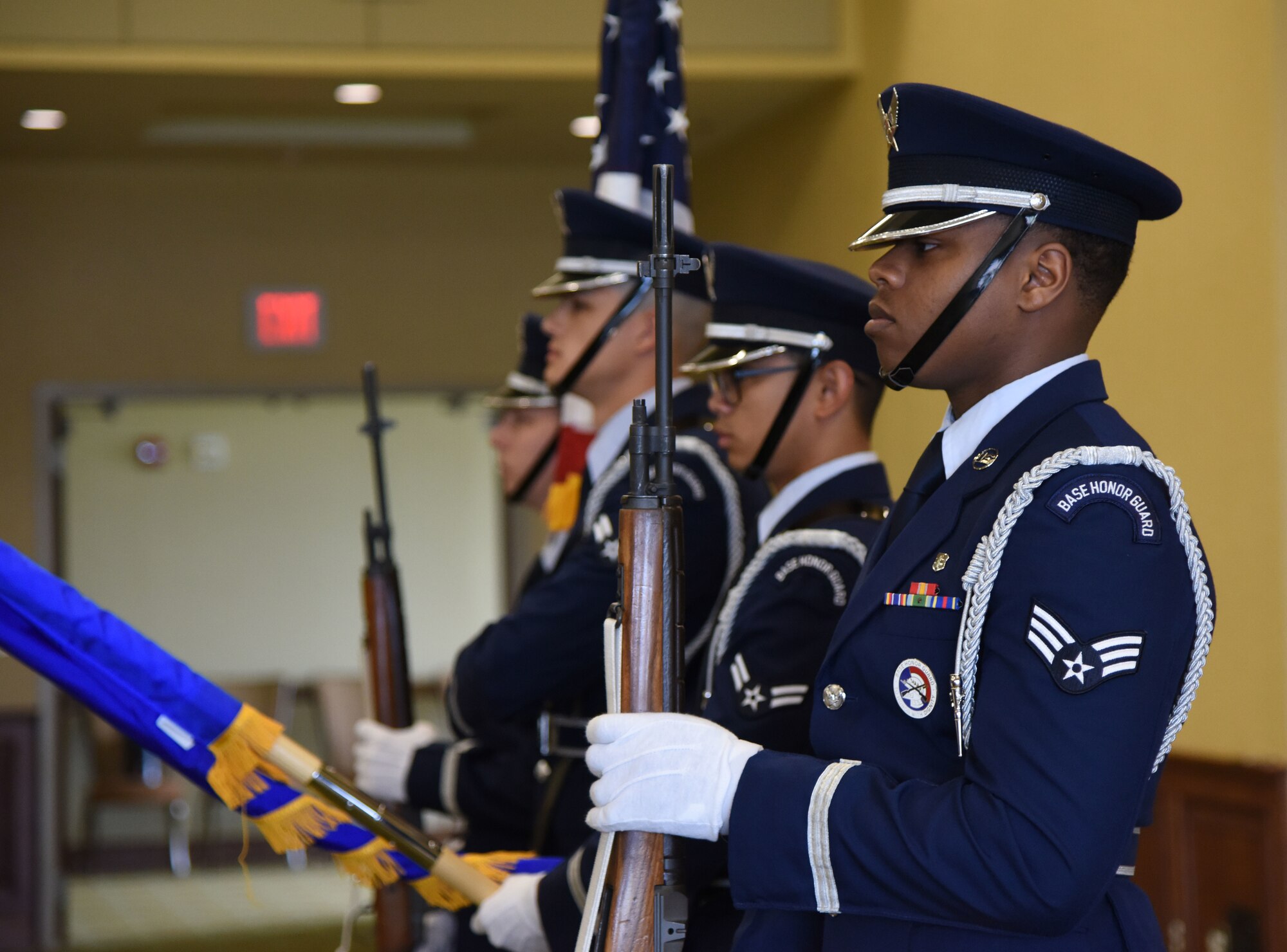 Keesler Honor Guard members present the colors during the 81st Force Support Squadron change of command ceremony in the Bay Breeze Event Center at Keesler Air Force Base, Mississippi, June 14, 2018. The passing of the guidon is a ceremonial symbol of exchanging command from one commander to another. (U.S. Air Force photo by Kemberly Groue)