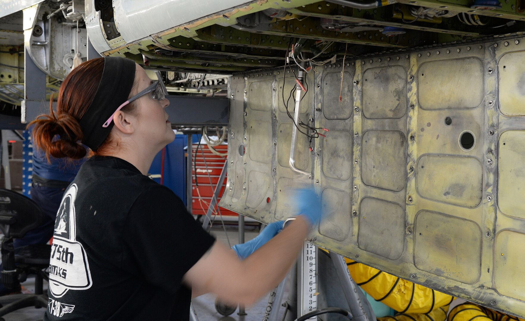 Melanie Blackstock, 575th Aircraft Maintenance Squadron fuels technician, removes screws from a fuel quantity probe April 17, 2018, at Joint Base San Antonio-Randolph, Texas. (U.S. Air Force photo by Alex R. Lloyd)