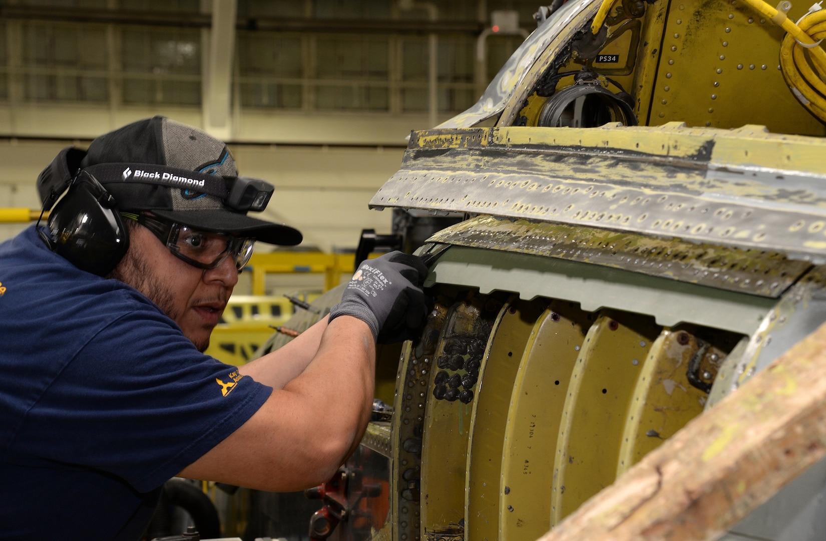 Michael Ramirez, 575th Aircraft Maintenance Squadron sheet metal technician, checks the alignment on a new left hand upper center longeron being installed on a T-38 Talon during the Pacer Classic III modification package April 17, 2018, at Joint Base San Antonio-Randolph, Texas. (U.S. Air Force photo by Alex R. Lloyd)