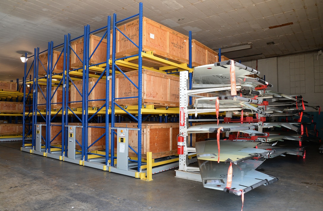 Complete wing sets along with crates holding up to 600 parts from each aircraft are kept safe and ready at Joint Base San Antonio-Randolph, Texas, to be returned to the main production building within minutes compared to hours or days before the new storage rack system was installed. (U.S. Air Force photo by Alex R. Lloyd)