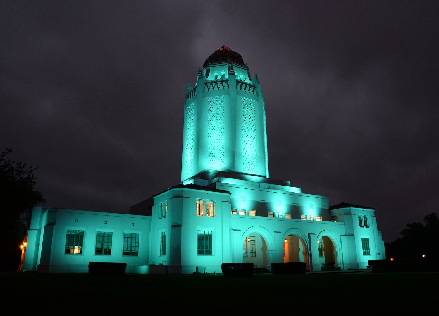 On an overcast morning, building 100 at Joint Base San Antonio-Randolph, Texas, nicknamed the Taj Mahal, glows brightly to welcome a new day. The building was completed in 1931 and is actually a 500,000-gallon water tank along with office space, base movie theater and is the most prominent location on base. (U.S. Air Force photo by Alex R. Lloyd)