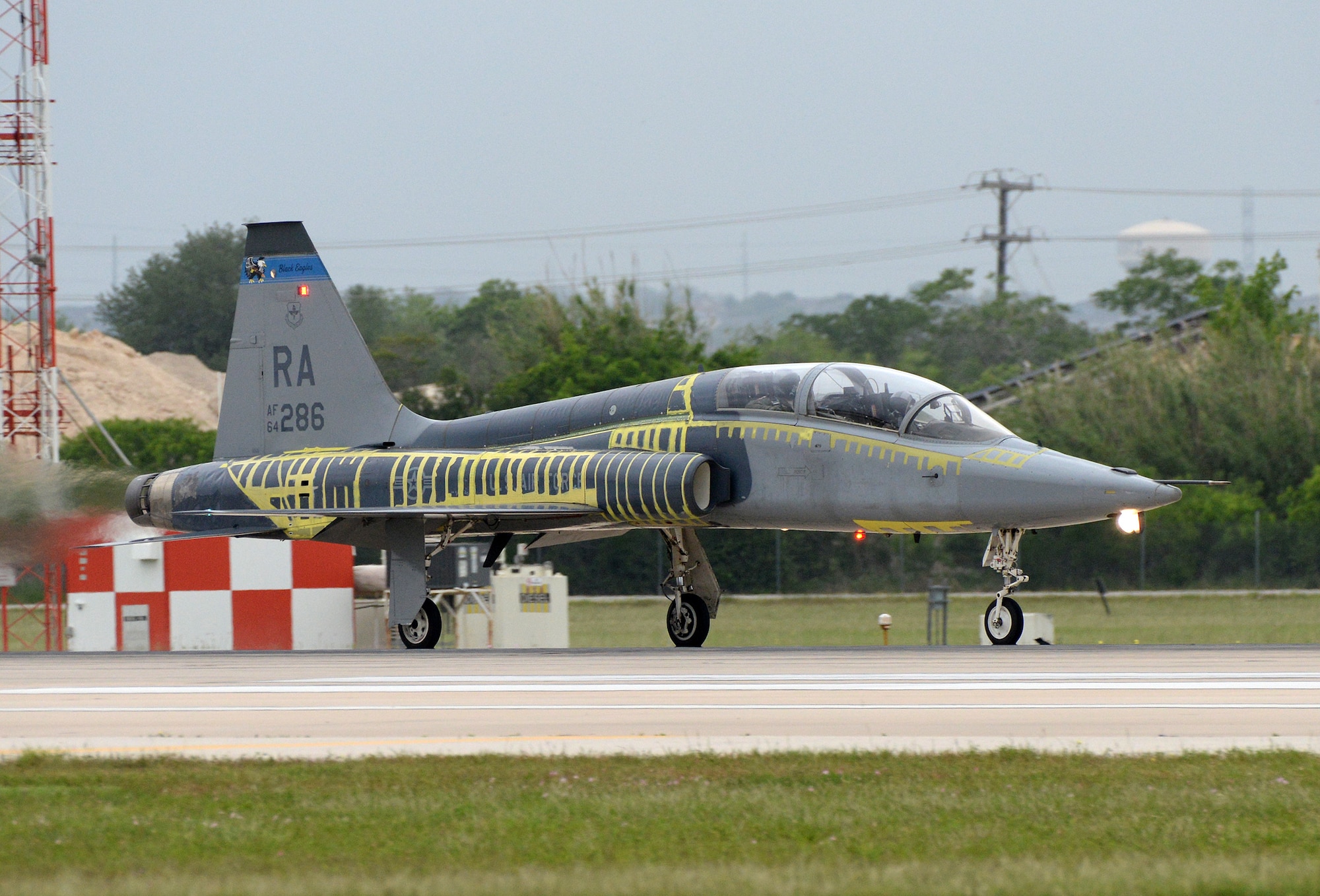 T-38C Talon Instructor Pilot (front), Lt. Col Edward Stapanon III, and Combat Systems Officer (rear), Maj. Brion Nielsen, begin their take-off roll for a training mission April 18, 2018, at Joint Base San Antonio-Randolph, Texas. The aircraft recently completed the Pacer Classic III modification package and still shows its distinctive tiger stripes that will be removed when the aircraft receives its next scheduled complete paint job. (U.S. Air Force photo by Alex R. Lloyd)
