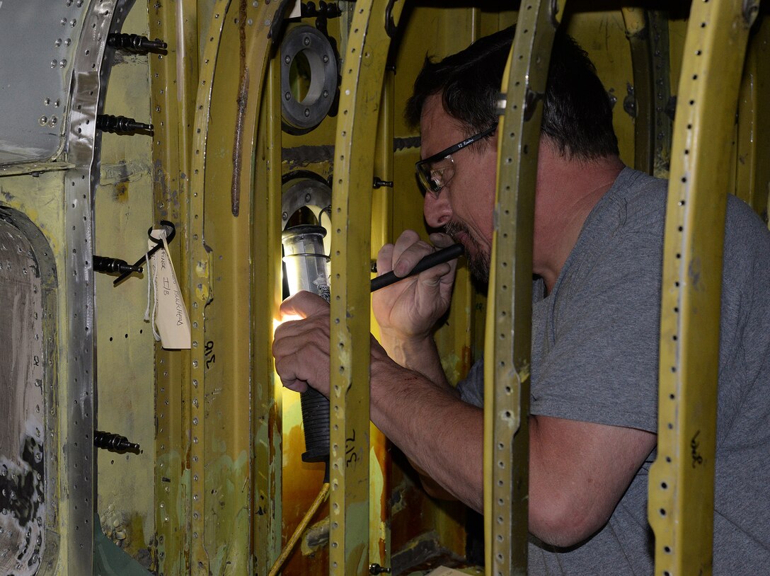 Lloyd Fellbaum, 575th Aircraft Maintenance Squadron sheet metal technician, works inside the confined space of what is normally the forward fuel bladder on a T-38 Talon April 18, 2018, at Joint Base San Antonio-Randolph, Texas. (U.S. Air Force photo by Alex R. Lloyd)