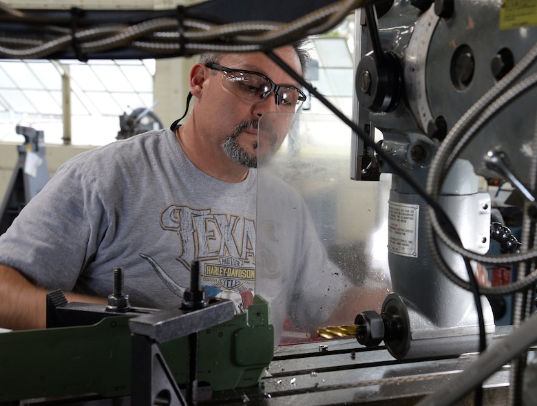 Ricardo Tarin, 575th Aircraft Maintenance Squadron aircraft maintenance machinist, drills new holes into an upper center longeron April 18, 2018, at Joint Base San Antonio-Randolph, Texas, that will be installed on a T-38 Talon during the Pacer Classic III upgrades.  (U.S. Air Force photo by Alex R. Lloyd)