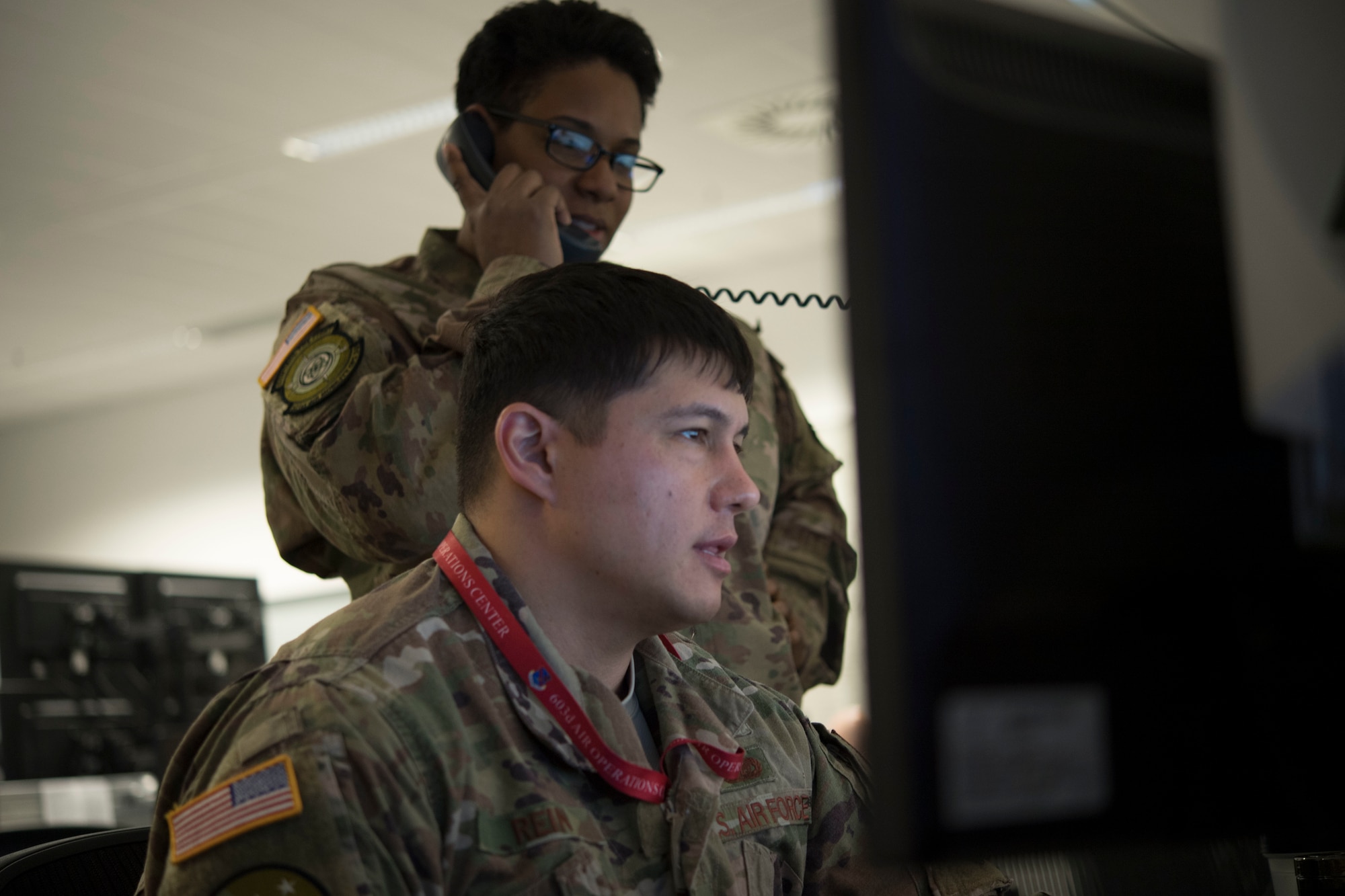 U.S. Air Force Tech. Sgt. Robert Rein, a  of the 621st Air Mobility Operations Squadron (AMOS) from Joint Base McGuire-Dix-Lakehurst in New Jersey, and U.S. Air Force Tech. Sgt. Jessica James, flight follower with the 321st AMOS from Travis Air Force Base in California, provide command and control during Exercise Swift Response 18 at Ramstein Air Base, RP, Germany on June 5, 2018. (U.S. Air Force photo by Tech Sgt. Robert Waggoner/RELEASED)