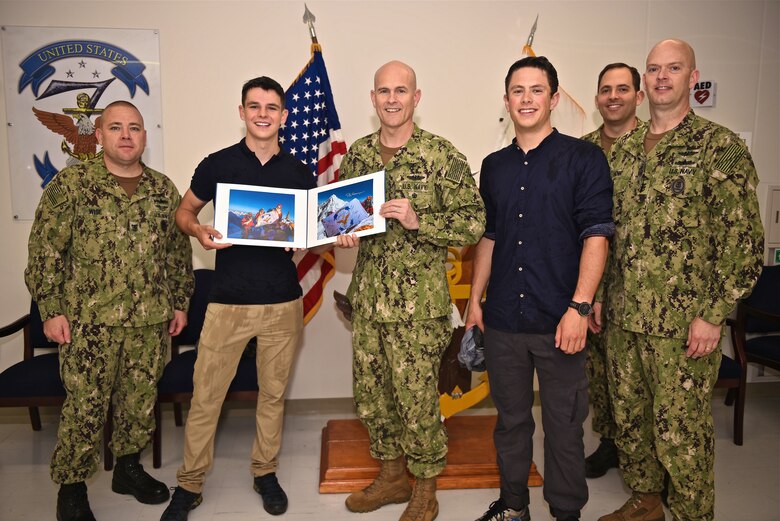 Matt Moniz poses with members of 7th Fleet Staff during his visit to Commander, Fleet Activities Yokosuka and USS Blue Ridge (LCC 19) June 12. Moniz returned a flag, that he flew on top of Mount Everest on May 20, 2018, to 7th Fleet headquarters and took time to learn more about the U.S. Navy while in Yokosuka.