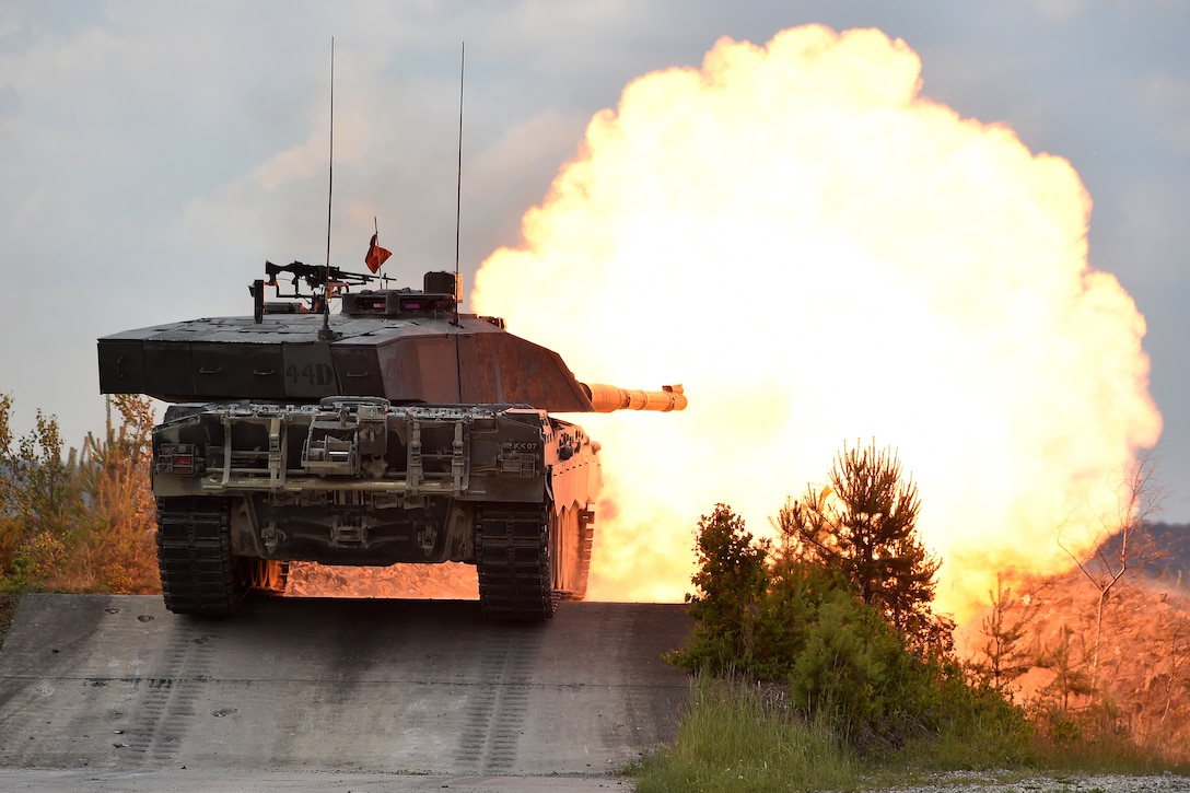 British soldiers fire a Challenger II main battle tank during the defensive operation lane.