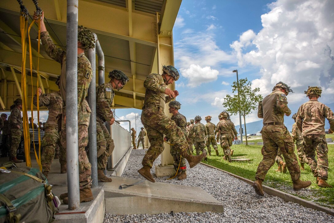 Soldiers conduct mock door exercises.