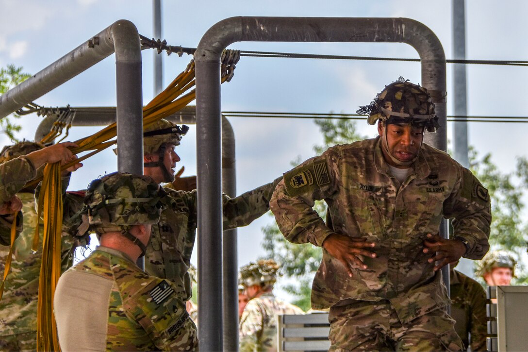 A soldier conducts mock door exiting exercises.